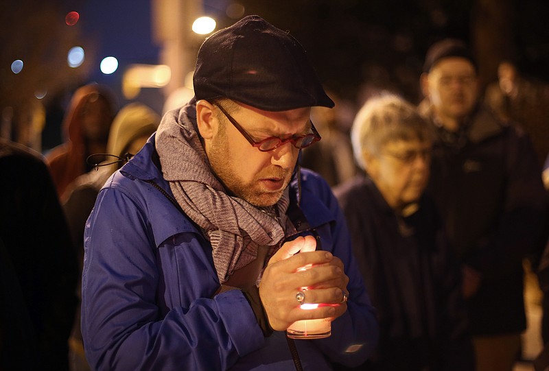 Michael Patter, senior minister at Central Congregational United Church of Christ, prays silently during a vigil for Kelly Gissendaner and protest against the death penalty Monday, March 2, 2015, on the steps of the State Capitol. Patter said he is scheduled to preside over Gissendaner's memorial service after she is executed.