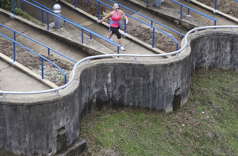 Nickie Schoonover makes her way up a snaking section of the Tennessee Riverwalk during her daily lunch run on Feb. 9, 2015. 