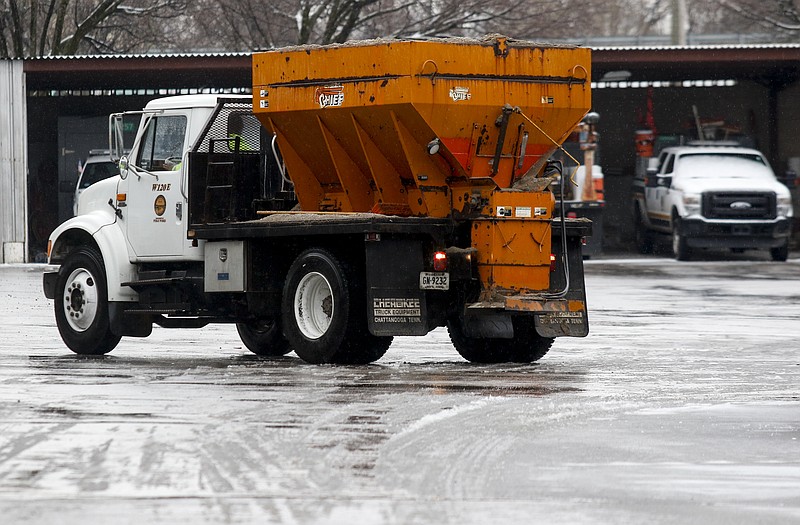 A salt truck pulls into the City of Chattanooga Public Works vehicle depot on Saturday, Feb. 21, 2015, after overnight winter weather left the area with a mix of snow, ice, and freezing rain in Chattanooga, Tenn.