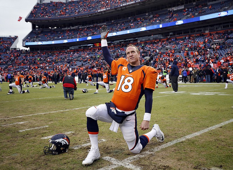 
              FILE - In this Jan. 11, 2015, file photo, Denver Broncos quarterback Peyton Manning stretches prior to the team's NFL divisional playoff football game against the Indianapolis Colts in Denver. A person with knowledge of the situation tells The Associated Press that Manning will return for a fourth season in Denver and 18th in the NFL. Manning will reduce his salary from $19 million to $15 million in 2015, according to the person who spoke on condition of anonymity because there was no official announcement. However, he can make up all of the $4 million pay cut by reaching certain performance benchmarks. (AP Photo/Jack Dempsey, File)
            