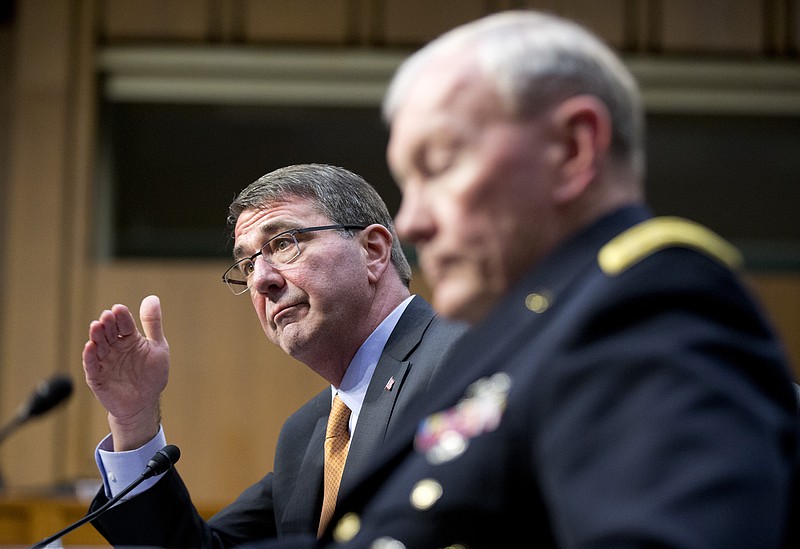 
              FILE - In this March 3, 2015 file photo, Defense Secretary Ash Carter, left, accompanied by Joint Chiefs Chairman Gen. Martin Dempsey, testifies on Capitol Hill in Washington before the Senate Armed Services Committee. Iran’s growing influence in Iraq is setting off alarm bells, and nowhere is the problem starker than in the high-stakes battle for Tikrit. It marks a crucial fight in the bigger war to expel the Islamic State group from Iraq, and yet Iran and the Shiite militias it empowers _ not the U.S. _ are leading the charge. Carter, under questioning from Sen. John McCain this week, acknowledged his concern when McCain asked if it alarms him that Iran “has basically taken over the fight.” (AP Photo/Manuel Balce Ceneta, File)
            