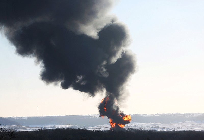 Smoke and flames erupt from the scene of a train derailment Thursday, March 5, 2015, near Galena, Ill. 