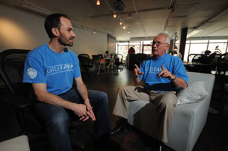 Mike Bradshaw, right, executive director of the CoLab, talks with Sheldon Grizzle, director of the Gig Tank. Bradshaw says as demand for Gig-based technologies will grow, Chattanooga should be well positioned as a test site for new Gig ideas and concepts.