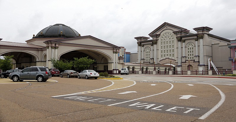 
              FILE - In this May 12, 2014 file photo, a few vehicles are parked in front of Harrah's Tunica casino in Robinsonville, Miss., prior to being shut down in June. A division of Caesars Entertainment Corp. is asking a federal bankruptcy judge for permission to "dismantle and liquidate" part of its shuttered Harrah's casino complex in Mississippi's Tunica County.  (AP Photo/Rogelio V. Solis, File)
            