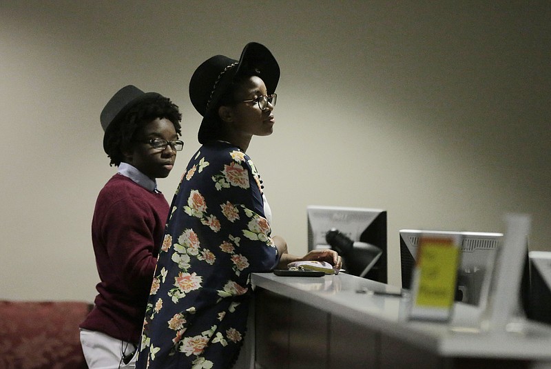 Shanté Wolfe, left, and Tori Sisson, right, wait for their marriage license to be processed before becoming the first couple to file their marriage license in Montgomery, Ala., in this Feb. 9, 2015, file photo.