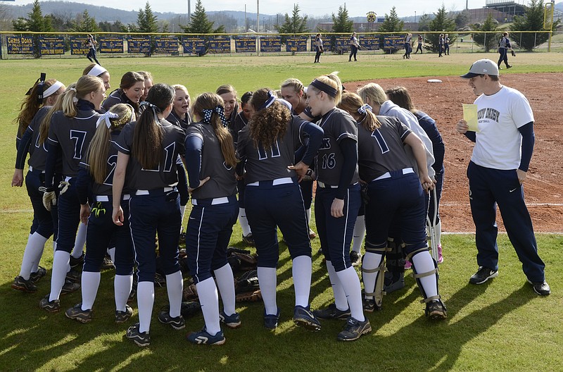 Soddy-Daisy girls softball coach Wes Skiles watches as his team huddles before their game at Walker
Valley in this March 18, 2014, file photo.