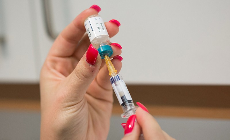 A doctor's assistant prepares a measles vaccination in Berlin on Feb. 24, 2015.