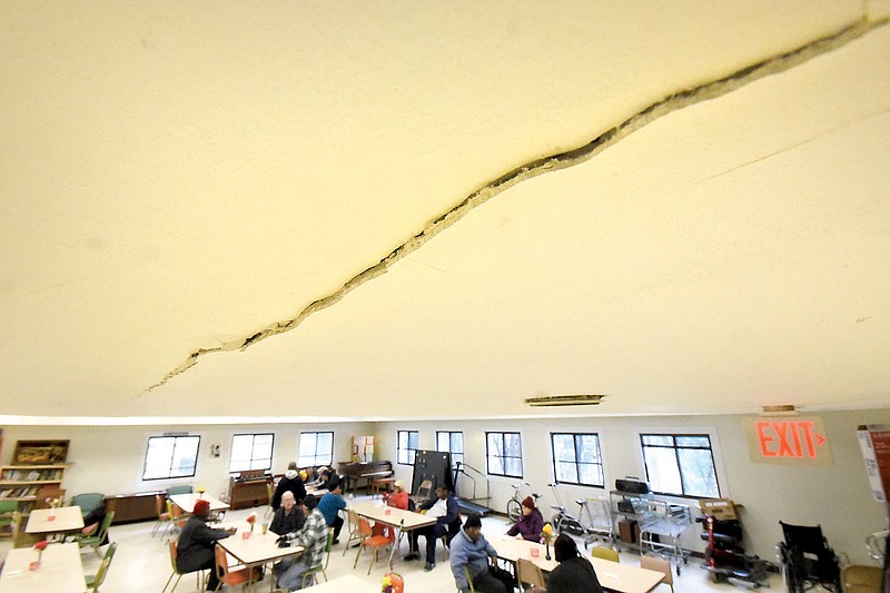 A crack in the ceiling creeps toward the commons area in the 955 building at Boynton Terrace.