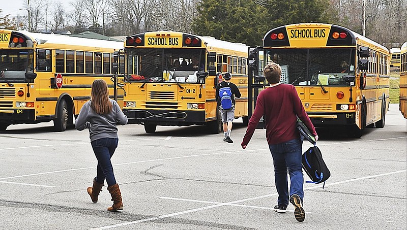 Dade County High School students head home at the end of the school day Monday, Mar. 9, 2015, in Trenton, Ga. The school day will be 15 minutes longer for these students starting next week. 