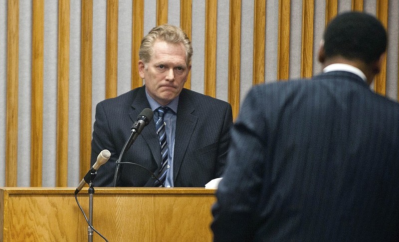 In this May 12, 2014 file photo, film director Randall Miller, left, takes the witness stand during a hearing before Chatham County Superior Court, Judge John Morse in Savannah, Ga. The director of a movie about musician Gregg Allman pleaded guilty Monday, March 9, 2015,  in a train crash that killed a camera assistant and injured six film workers, and prosecutors in exchange dropped charges against his wife and business partner. As part of the plea deal, Director Randall Miller will spend two years in the county jail and another eight on probation on involuntary manslaughter and criminal trespassing charges. He also will pay a $20,000 fine. 