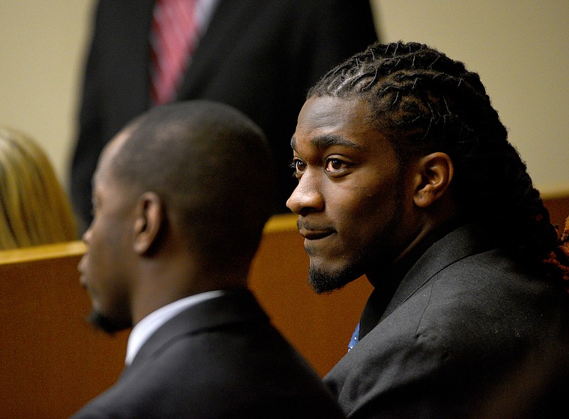 Former University of Tennessee football player A.J. Johnson, right, and current player Michael Williams wait to be arraigned on two counts of aggravated rape Monday, Mar. 9, 2015, in Knoxville.