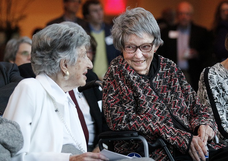 Mai Bell Hurley, right, looks to Ruth Holmberg on Tuesday before accepting ArtsBuild's Ruth Holmberg Arts Leadership Award during a ceremony at the Hunter Museum of American Art. Hurley was presented with the inaugural award for her historic work pioneering advocacy for the arts in Chattanooga.