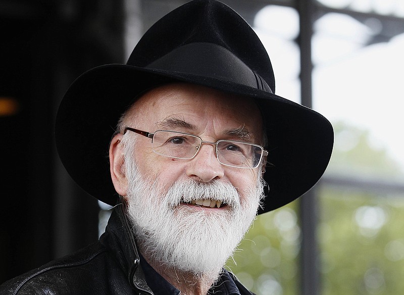 
              FILE - This is a Tuesday, Oct. 5, 2010   file photo of British author Terry Pratchett  seen at the Conservative party conference in Birmingham, England.  Fantasy writer  Pratchett, creator of the “Discworld” series   died  Thursday March 12, 2015 aged 66.  Pratchett, who suffered from a very rare form of early onset Alzheimer's disease, had earned wide respect throughout Britain with his dignified campaign for the right of critically ill patients to choose assisted suicide.  (AP Photo/Kirsty Wigglesworth, File)
            