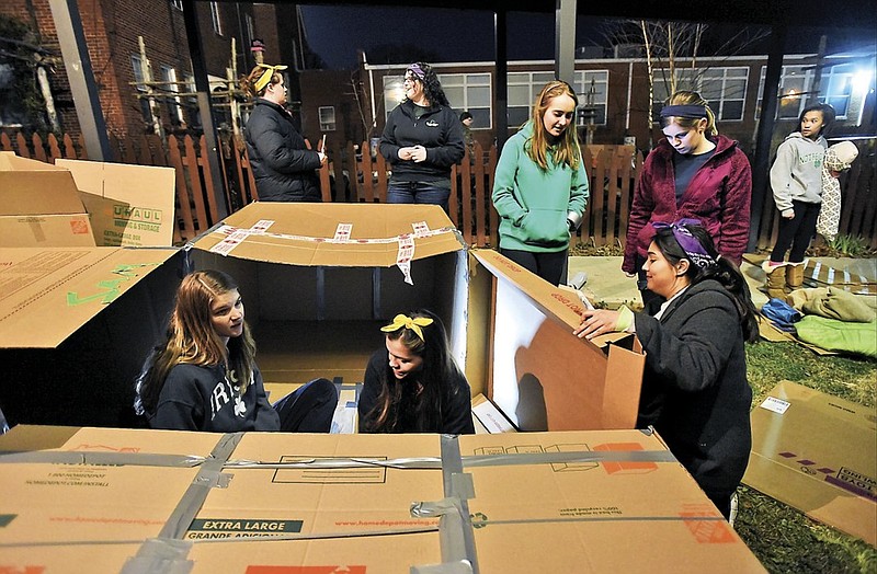 Girls prepare boxes to camp out during "Let it Growl," a 30-hour period to raise the awareness of homelessness.