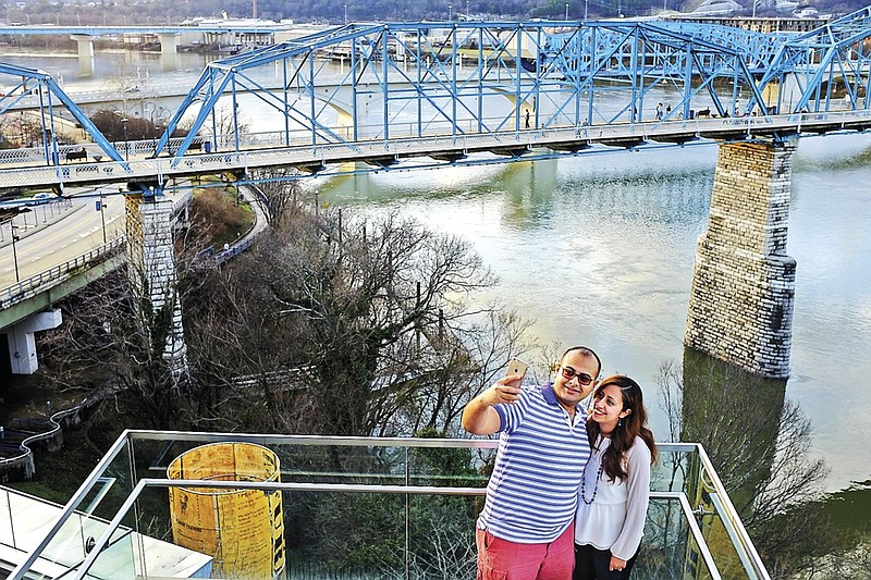 Mena Shaker, left, and Elaine Shaker take a selfie from the observation deck of the Hunter Museum of American Art with the Walnut Street Bridge in the background Wednesday, March 11, 2015, in Chattanooga, Tenn.