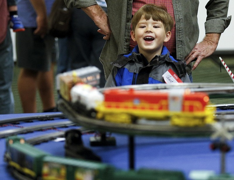 Mason Folkerts watches electric trains circle tracks at the Dixie Division of the Train Collectors Association's model train show Saturday, March 7, 2015, at The Colonnade in Ringgold, Ga. Train enthusiasts bought, sold, and traded an assortment of model trains and related accessories.