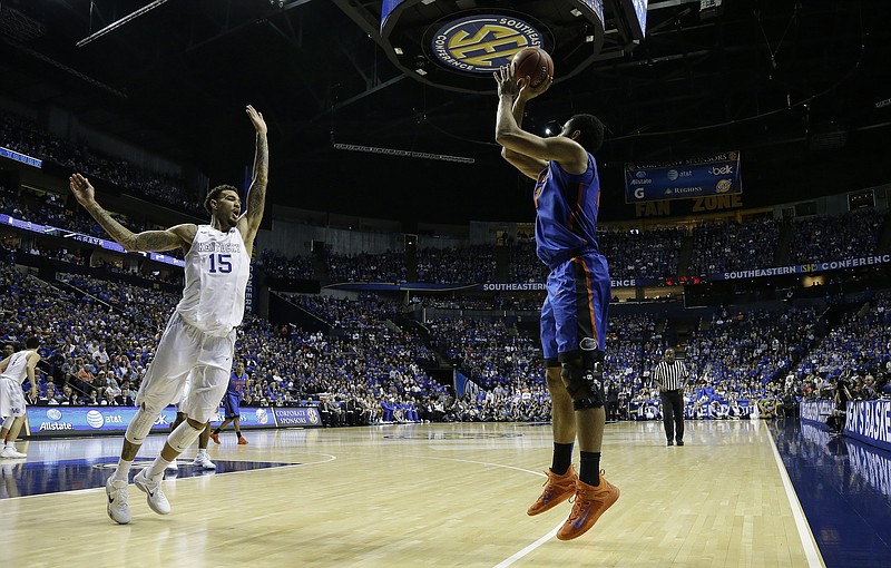 Florida forward Jon Horford (21) shoots against Kentucky forward Willie Cauley-Stein (15) during the second half of an NCAA college basketball game in the quarter final round of the Southeastern Conference tournament Friday, March 13, 2015, in Nashville.