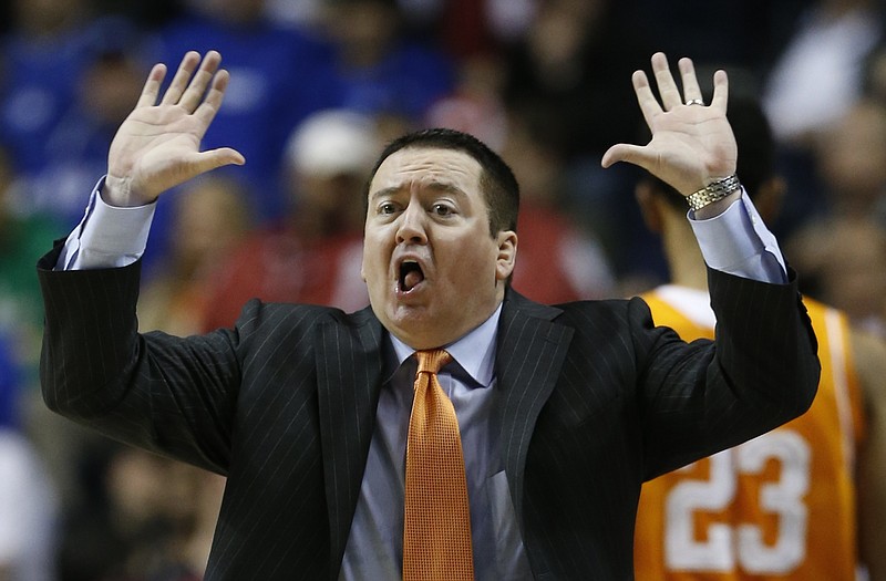 Tennessee head coach Donnie Tyndall calls a play against Arkansas during their game in the quarterfinal round of the Southeastern Conference tournament Friday, March 13, 2015, in Nashville.