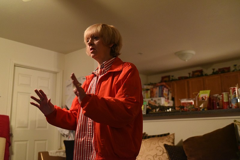 Donna Robertson, 61, talks about her living conditions and her family members, inside her living room Friday in Hixson. Robertson is bipolar and has had a case manager here since 2008. TennCare is planning to gut its mental health case management program, which funds treatment for people like Robertson.