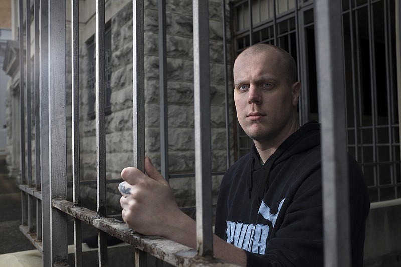 Robert Alan Bradshaw, who spent 8 months in jail charged with rape before he was cleared by DNA evidence, is photographed Friday, March 13, 2015, in a downtown Chattanooga parking lot. Bradshaw was released two weeks ago. (Staff Photo Illustration by Doug Strickland)