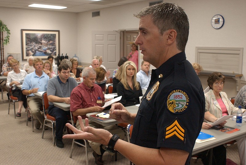 Sgt. Bobby Simpson of the Chattanooga Police Department talks to a group of realtors at the Chattanooga Association of Realtors in 2005.