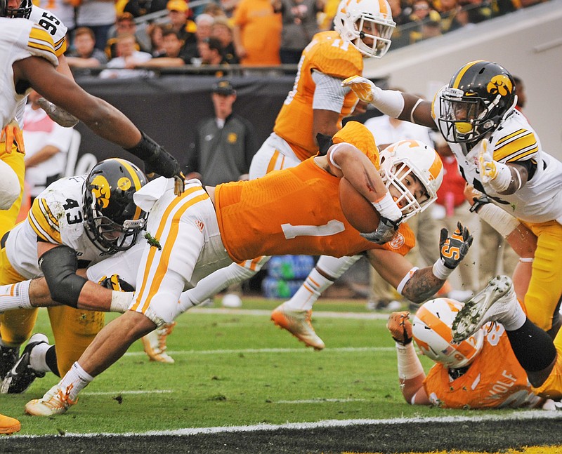 Tennessee's Jalen Hurd dives into the end zone for the Volunteers first touchdown of the game during the first half of the TaxSlayer Bowl NCAA college football game against Iowa, Friday, Jan. 2, 2015, in Jacksonville, Fla.