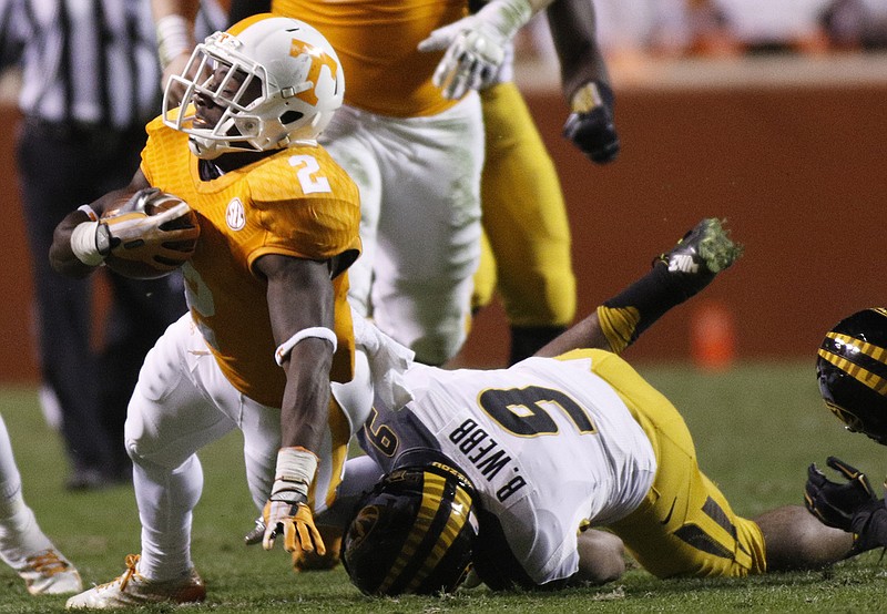 Missouri safety Braylon Webb (9) tackles Tennessee wide receiver Pig Howard (2) during the Vols' football game against the Missouri Tigers on Saturday, Nov. 22, 2014, at Neyland Stadium in Knoxville.