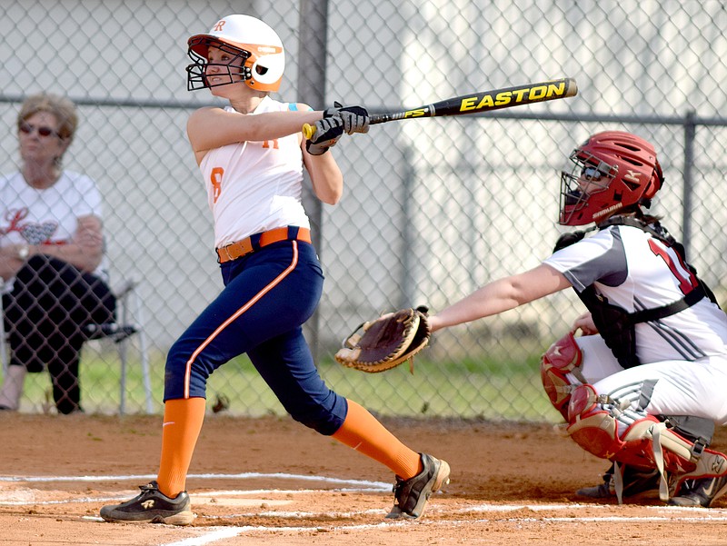 East Ridge's Morgan Monteith (8) watches the flight of her first double of the game against Signal Mountain on March 17 in TSSAA action at East Ridge.