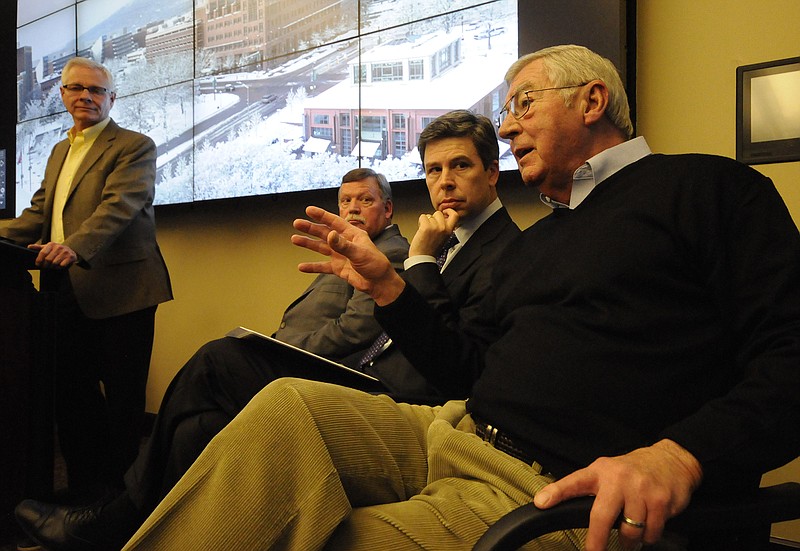 Joe Ferguson, right, chairman of EPB's board of directors, responds to questions in this file photo. EPB Chief Operations Officer David Wade, Hamilton County Mayor Jim Coppinger and Chattanooga Mayor Andy Berke, from left, listen.