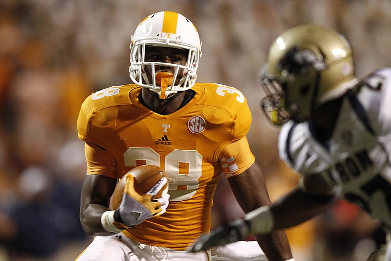 Tennessee Volunteers fullback Justin King (38) runs for yardage during the first half of an NCAA college football game between Akron and Tennessee on Saturday, Sept. 22, 2012, in Knoxville.