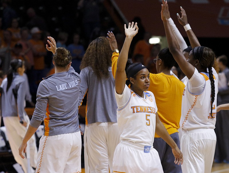 The Tennessee women's basketball team raises their hands in the air after their NCAA tournament basketball win over the Boise State Broncos on Saturday, March 21, 2015, at the Thompson-Boling Arena in Knoxville, Tenn.