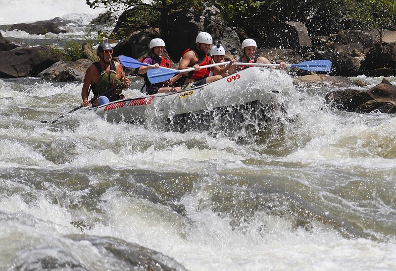 Rafters with Rolling Thunder run a rapid called "Grumpy's" on the Ocoee River.