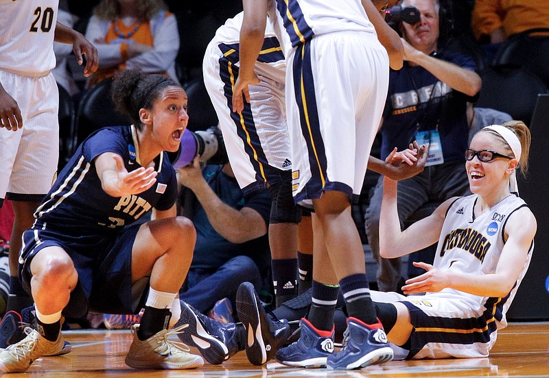 Pittsburgh guard Brianna Kiesel (3), left, and UTC guard Alicia Payne (1) react to a foul called on Kiesel in the 1st half of the Mocs' NCAA tournament basketball game against the Pittsburgh Panthers on Saturday, March 21, 2015, at the Thompson-Boling Arena in Knoxville, Tenn.