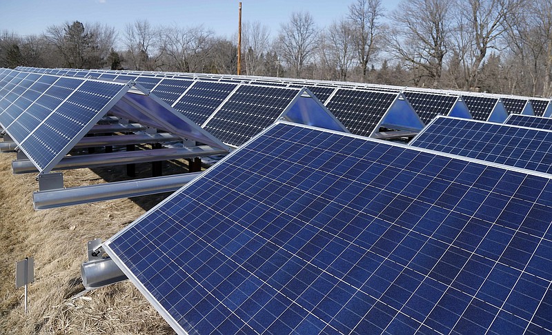 In this Feb. 26, 2015, photo, solar panels that are part of the Wright-Hennepin Cooperative Electric Association's community gardens are shown in Rockford, Minn.