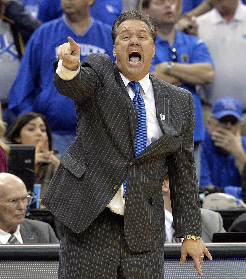 
              Kentucky head coach John Calipari shouts instructions to his team during the second half of an NCAA tournament college basketball game in Louisville, Ky., Saturday, March 21, 2015. Kentucky won 64-51. (AP Photo/Timothy D. Easley)
            