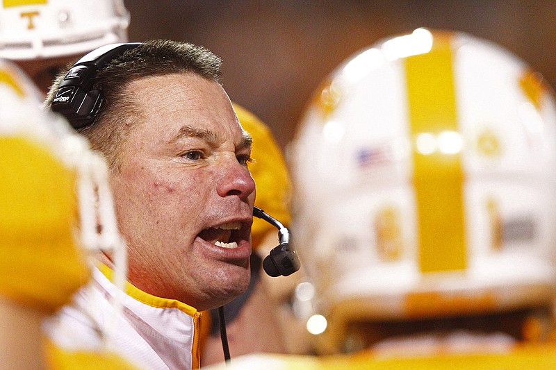 Tennessee head coach Butch Jones yells at his players during a football game.