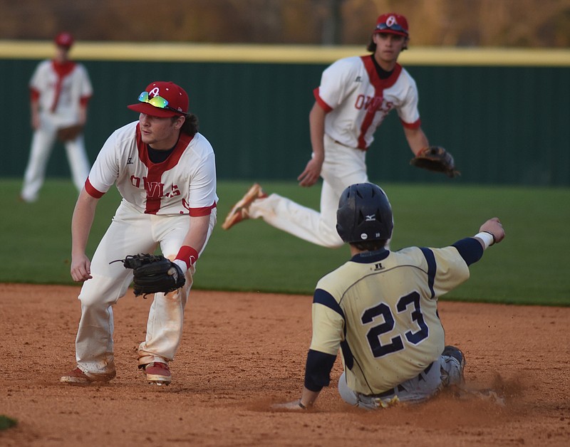 Soddy-Daisy's Chandler Sulcer slides safely into second as Ooltewah's Hayden Bradley waits for the ball during the game Monday at Ooltewah High School.