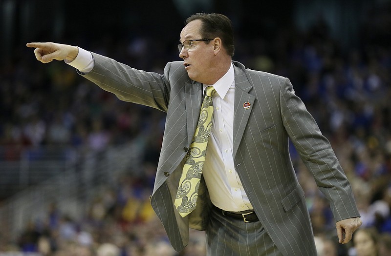 Wichita State head coach Gregg Marshall directs his team during the first half of an NCAA tournament college basketball game against Indiana in the Round of 64, Friday, March 20, 2015, in Omaha, Neb.