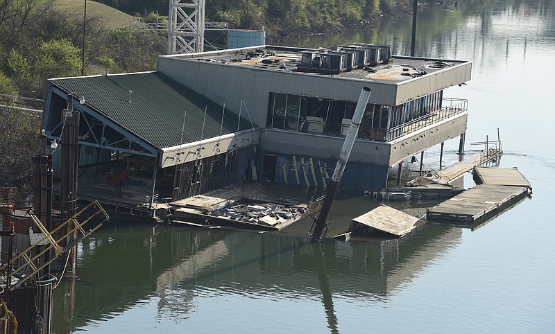 The abandoned restaurant barge known as the Casey barge slowly sinks in this March 24, 2015, photo. 