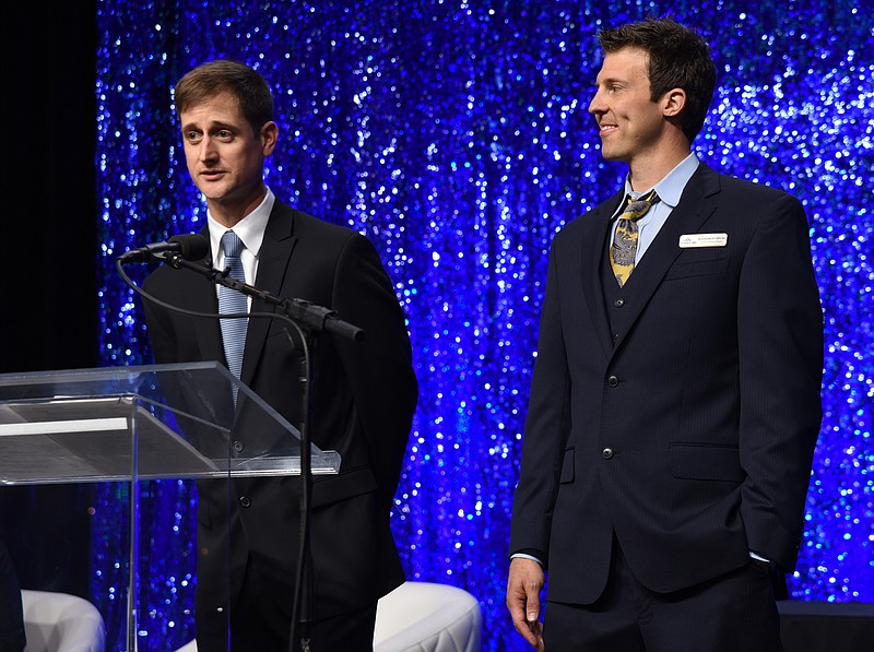Summit Physical Therapy's Dan Dotson, left, and Kevin Kostka give their acceptance speech Wednesday, March 25, 2015, after winning their Chamber of Commerceat Small Business award at the Chattanooga Convention Center. 