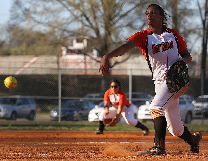 East Ridge pitcher Alexis Moore hurls the ball during a Central versus East Ridge softball game on Tuesday, April 1, 2014, at East Ridge High School.