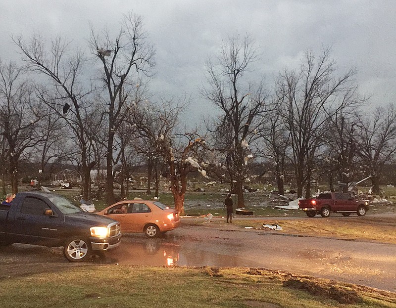 Debris litters the area after a storm swept through the area and damaged homes in Sand Springs, Okla. The slow start to the nation's tornado season came to a blustery end Wednesday when tornadoes hit Arkansas and Oklahoma. (AP Photo/Tulsa World, Matt Barnard) 