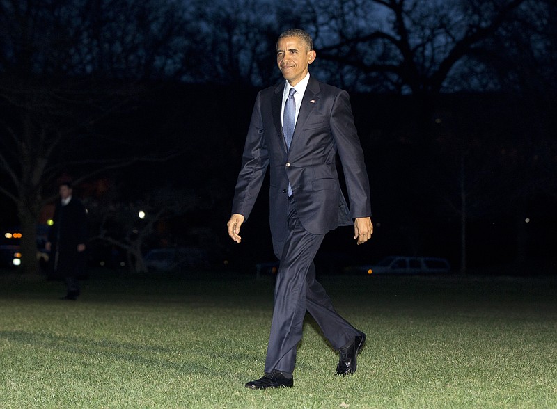 
              President Barack Obama walks across the South Lawn to the White House as he arrives on Marine One, Thursday, March 26, 2015, in Washington, as he returns from Birmingham, Ala., where he spoke about the economy. (AP Photo/Carolyn Kaster)
            