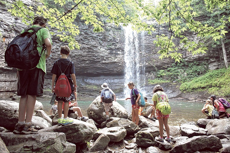 Camp Lookout campers explore the shore area by one of Cloudland Canyon's waterfalls while taking a scenic break from hiking Wednesday.