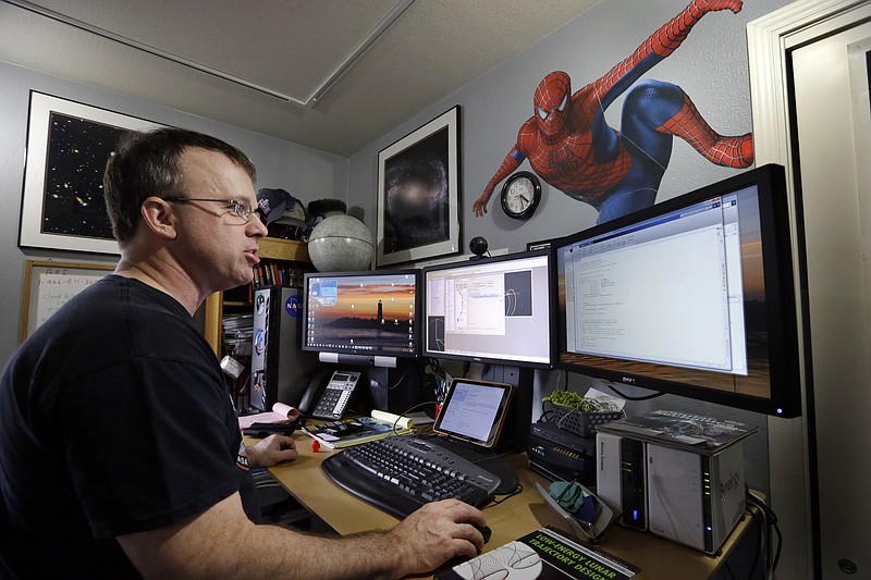 
              Mike Loucks sits in his home space exploration engineering office Thursday, March 26, 2015, in Friday Harbor, Wash., in the San Juan Islands. Loucks lost Internet and phone service during a 10-day outage on the island in 2013. Other regions around the country also have fallen dark in recent years, sometimes for days at a time, because of failures or accidents affecting the nation’s broadband infrastructure. The failures have revealed vulnerabilities in the backbone of the nation’s high-speed Internet highway, which often lacks the detour routes necessary to quickly restore service when outages occur outside of major cities. (AP Photo/Elaine Thompson)
            