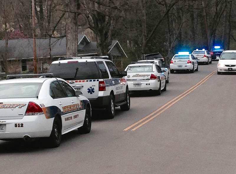 Hamilton County Sheriff's deputies's cruisers, SWAT vehicles line the road at 208 Hedgewood Dr. in Red Bank.