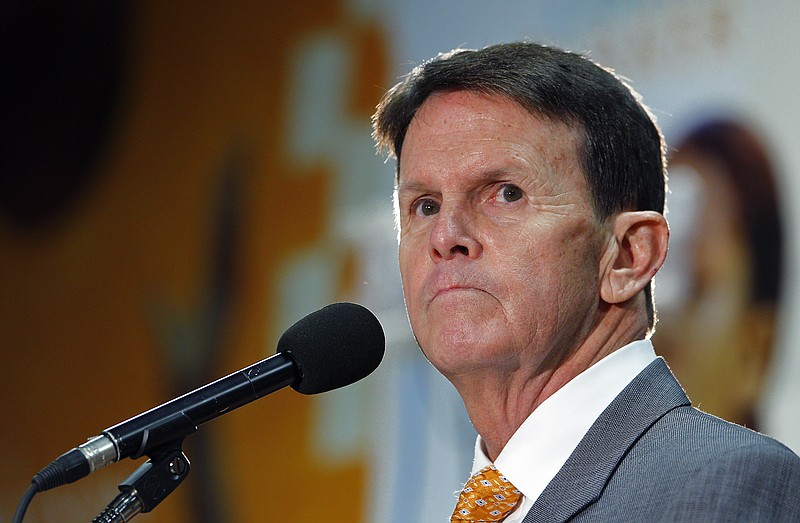 University of Tennessee athletic director Dave Hart pauses as he speaks to reporters about the firing of head basketball coach Donnie Tyndall on Friday, March 27, 2015, in Knoxville.