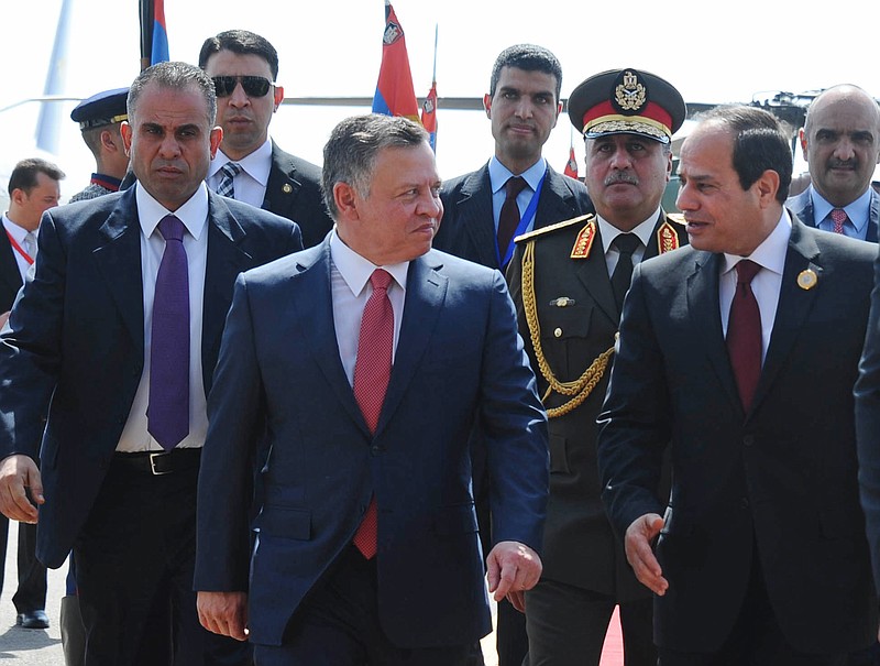 
              Egyptian President Abdel Fattah al-Sisi, right, greets Jordan's King Abdullah II on his arrival to attend an Arab summit, in Sharm el-Sheikh, South Sinai, Egypt, Saturday, March 28, 2015. In a speech to Arab leaders, Yemen's embattled president on Saturday called Shiite rebels who forced him to flee the country "puppets of Iran," directly blaming the Islamic Republic for the chaos there and demanding airstrikes against rebel positions continue until they surrender. (AP Photo/MENA)
            