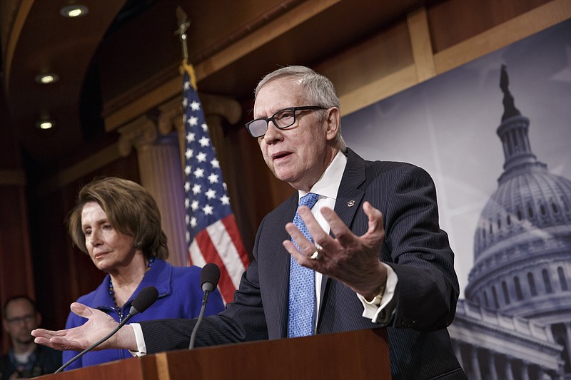 
              FILE - In this Feb. 26, 2015 file photo, Senate Minority Leader Harry Reid of Nev., accompanied by House Minority Leader Nancy Pelosi of Calif., gestures during a news conference on Capitol Hill in Washington. Reid is announcing he will not seek re-election to another term. The 75-year-old Reid says in a statement issued by his office Friday that he wants to make sure Democrats regain control of the Senate next year and that it would be "inappropriate" for him to soak up campaign resources when he could be focusing on putting the Democrats back in power.  (AP Photo/J. Scott Applewhite)
            
