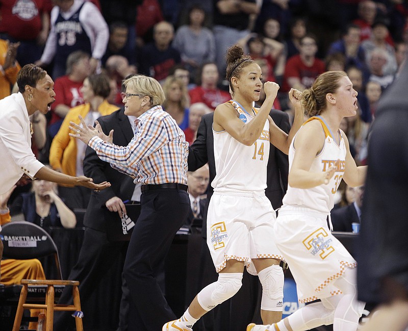 Tennessee's Andraya Carter (14) and teammate Alexa Middleton (33) react after a play during overtime in theirl regional semifinal game against Gonzaga in the NCAA tournament, Saturday, March 28, 2015, in Spokane, Wash. Tennessee won 73-69 in overtime.